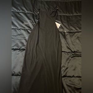 Brand new black backless dress.